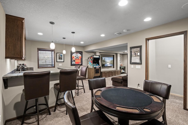 interior space with recessed lighting, light carpet, and a textured ceiling