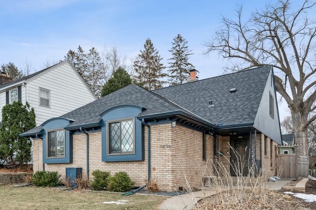 rear view of property featuring a yard