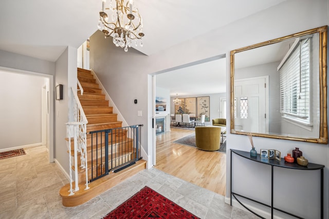 entrance foyer featuring a notable chandelier and light wood-type flooring