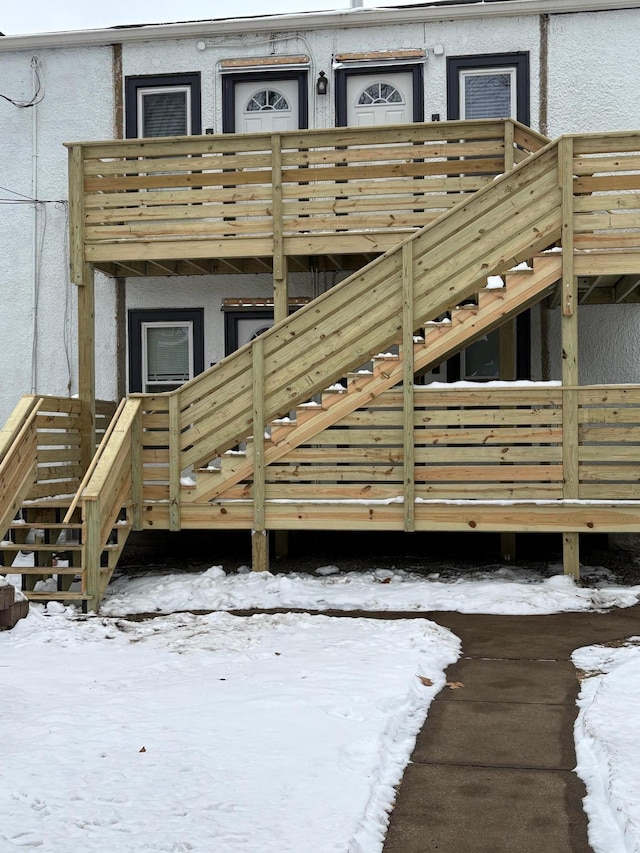 view of snow covered property entrance