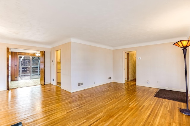 unfurnished room featuring light hardwood / wood-style floors