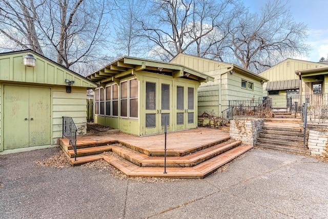 rear view of house with a deck