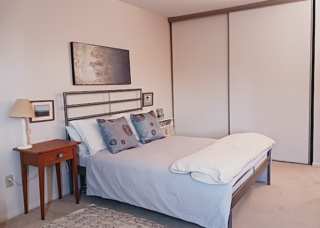 carpeted bedroom with a closet