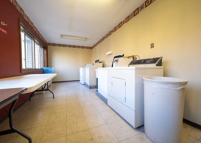 laundry room featuring washer and clothes dryer