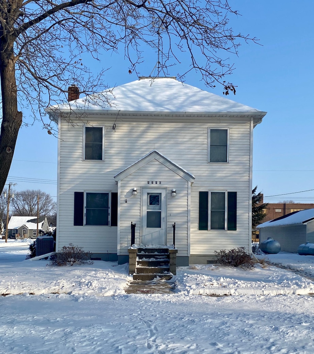 view of front of home featuring central AC unit