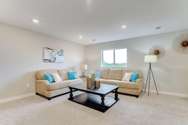 living room featuring recessed lighting, baseboards, and light colored carpet