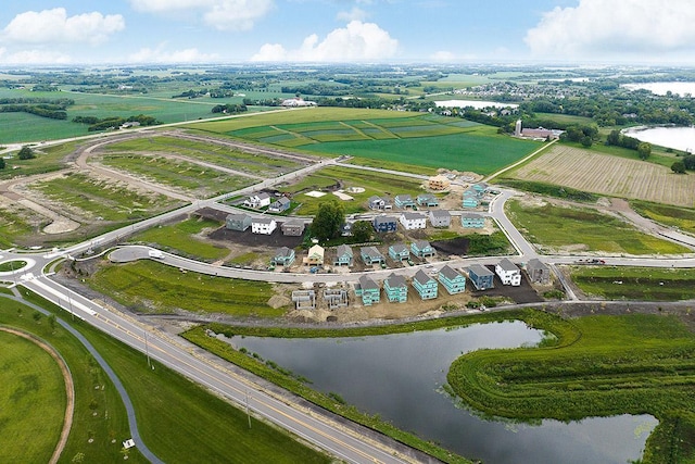 birds eye view of property featuring a water view and a rural view