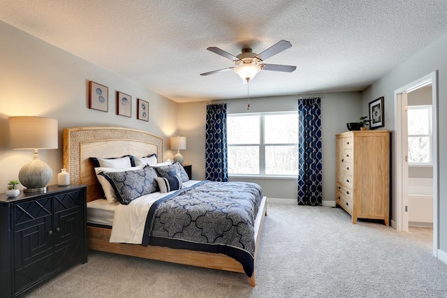 bedroom with light carpet, ceiling fan, multiple windows, and baseboards