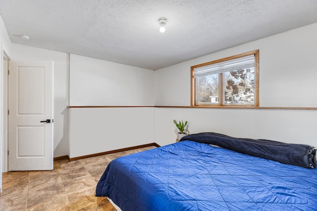 bedroom featuring a textured ceiling