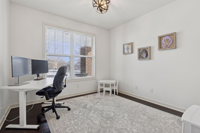 office space featuring hardwood / wood-style floors and baseboards