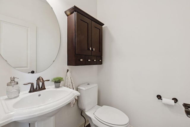 bathroom featuring a sink and toilet