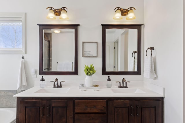 full bathroom with a sink and double vanity