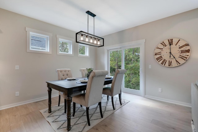 dining area with light hardwood / wood-style floors