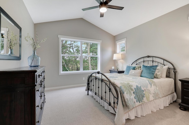 bedroom featuring ceiling fan, light colored carpet, and lofted ceiling