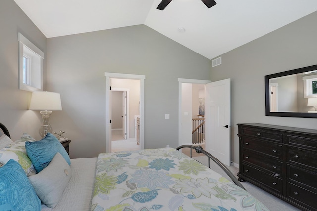 carpeted bedroom featuring ceiling fan and lofted ceiling