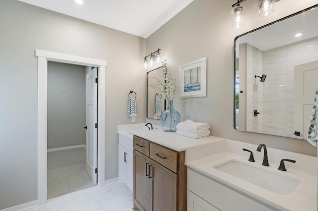 bathroom with vanity and a shower