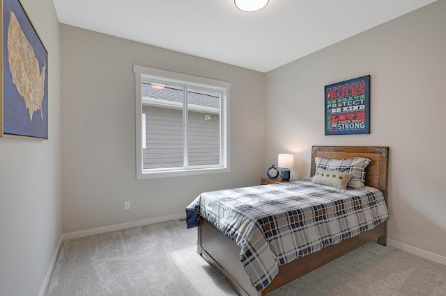 bedroom with light colored carpet