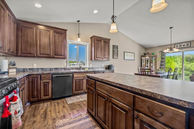 kitchen with dishwasher, vaulted ceiling, dark countertops, dark wood-type flooring, and stainless steel range with gas cooktop