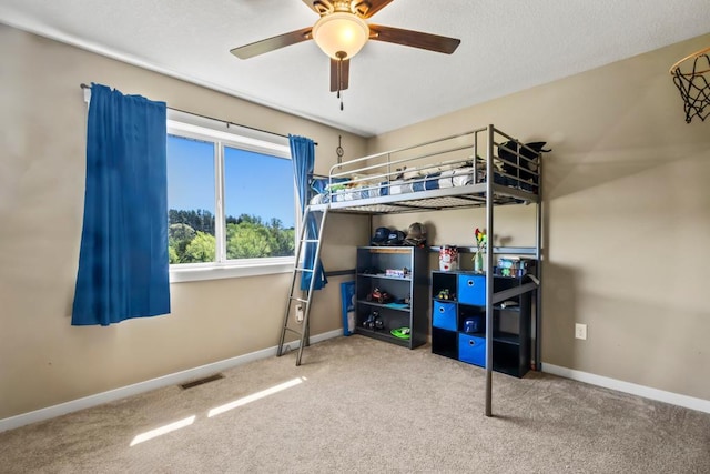 bedroom with carpet flooring, baseboards, and ceiling fan
