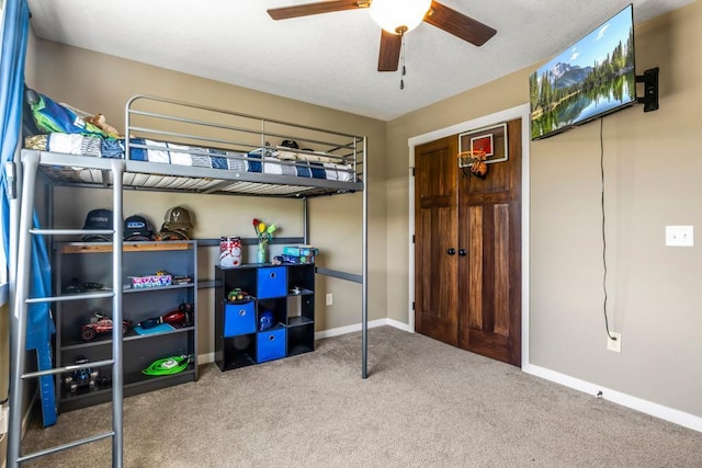 carpeted bedroom with baseboards