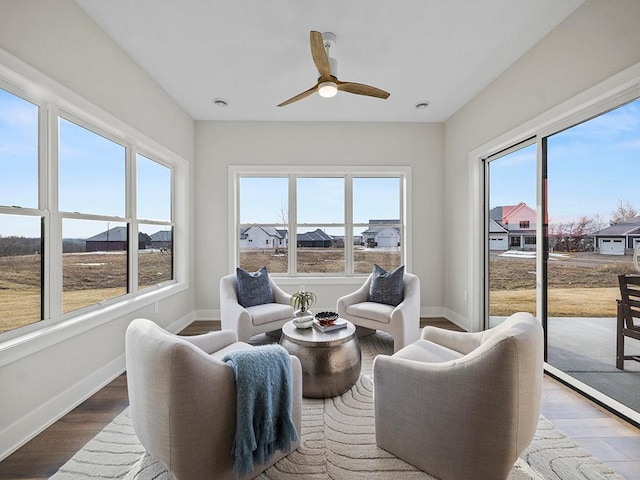 sunroom with ceiling fan