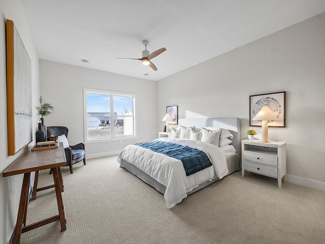 bedroom with ceiling fan and carpet