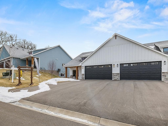 modern farmhouse style home featuring a garage