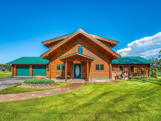 log-style house featuring a garage and a front lawn