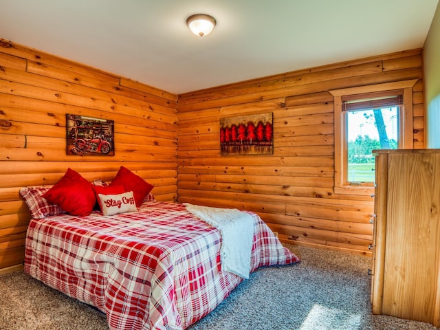 bedroom featuring carpet flooring and log walls