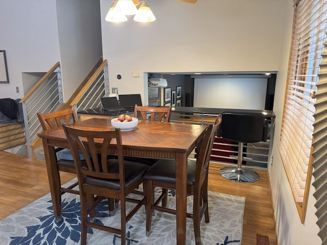 dining room with a chandelier and hardwood / wood-style flooring