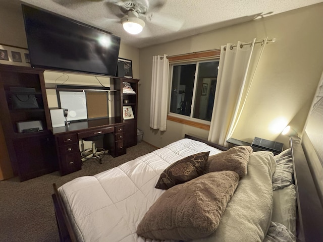 bedroom featuring ceiling fan, a textured ceiling, and dark colored carpet