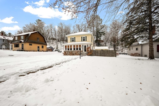 view of snow covered house