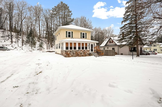 view of front facade featuring a sunroom