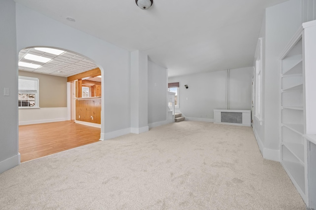 unfurnished living room with light carpet