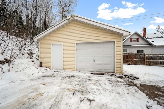 view of snow covered garage