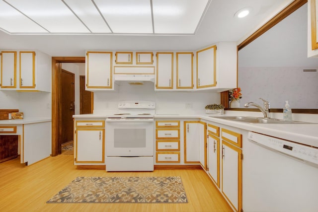 kitchen with white cabinets, white appliances, and sink