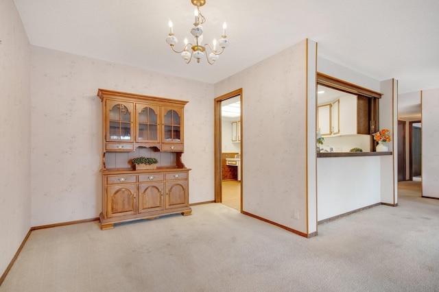 interior space with a notable chandelier and light colored carpet