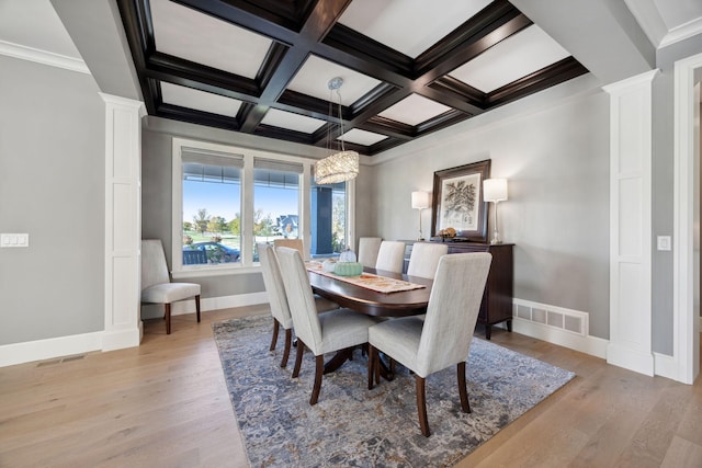 3175 Tuckborough Trl, Medina, MN 55356 - dining room with decorative columns, light wood-style flooring, beam ceiling, coffered ceiling, and ornamental molding