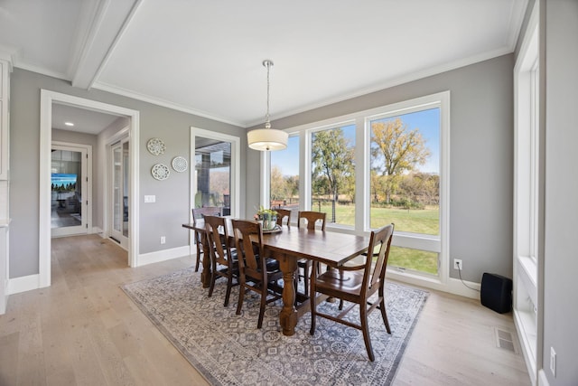 3175 Tuckborough Trl, Medina, MN 55356 - dining room with light wood finished floors, crown molding, and beam ceiling