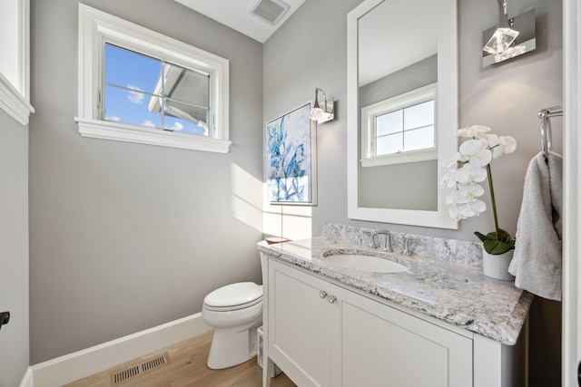 3175 Tuckborough Trl, Medina, MN 55356 - half bathroom with vanity and wood finished floors