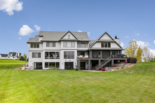 3175 Tuckborough Trl, Medina, MN 55356 - back of property with a yard, a chimney, stairs, and a shingled roof