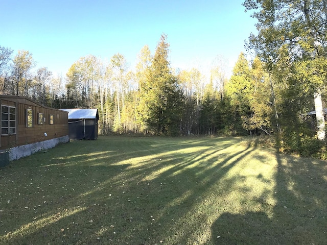 1961 Town Rd Unit 118, Birchdale, MN 56629 - view of grassy yard featuring a view of trees