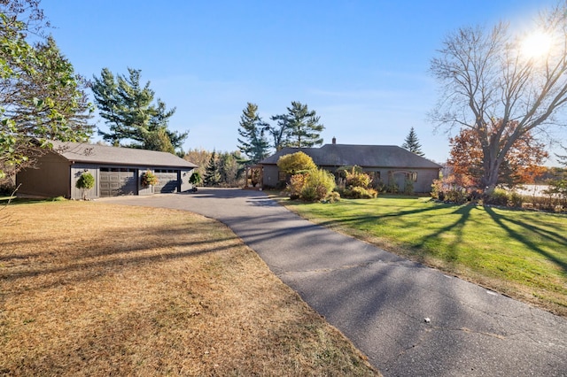 ranch-style home with a front lawn