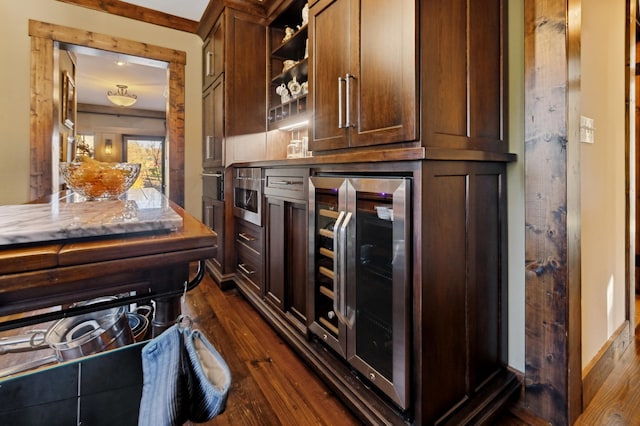 kitchen featuring dark hardwood / wood-style floors and wine cooler