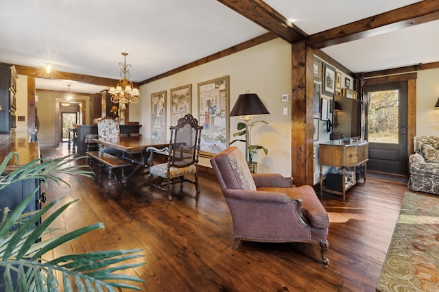 interior space featuring plenty of natural light, dark wood-type flooring, and an inviting chandelier