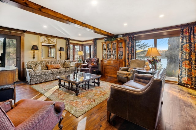 living room with beam ceiling and hardwood / wood-style floors