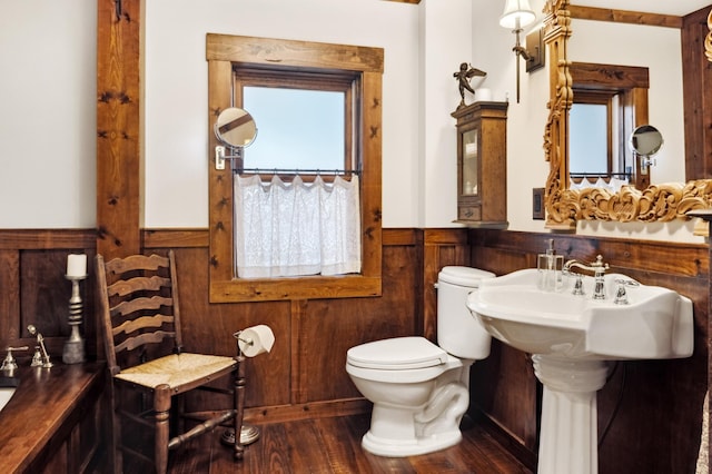 bathroom featuring hardwood / wood-style floors, toilet, and a wealth of natural light