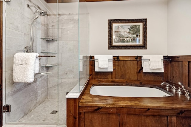 bathroom featuring sink and plus walk in shower