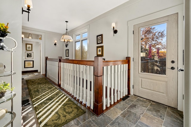 hallway featuring an inviting chandelier