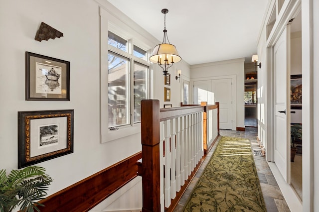 hallway featuring an inviting chandelier